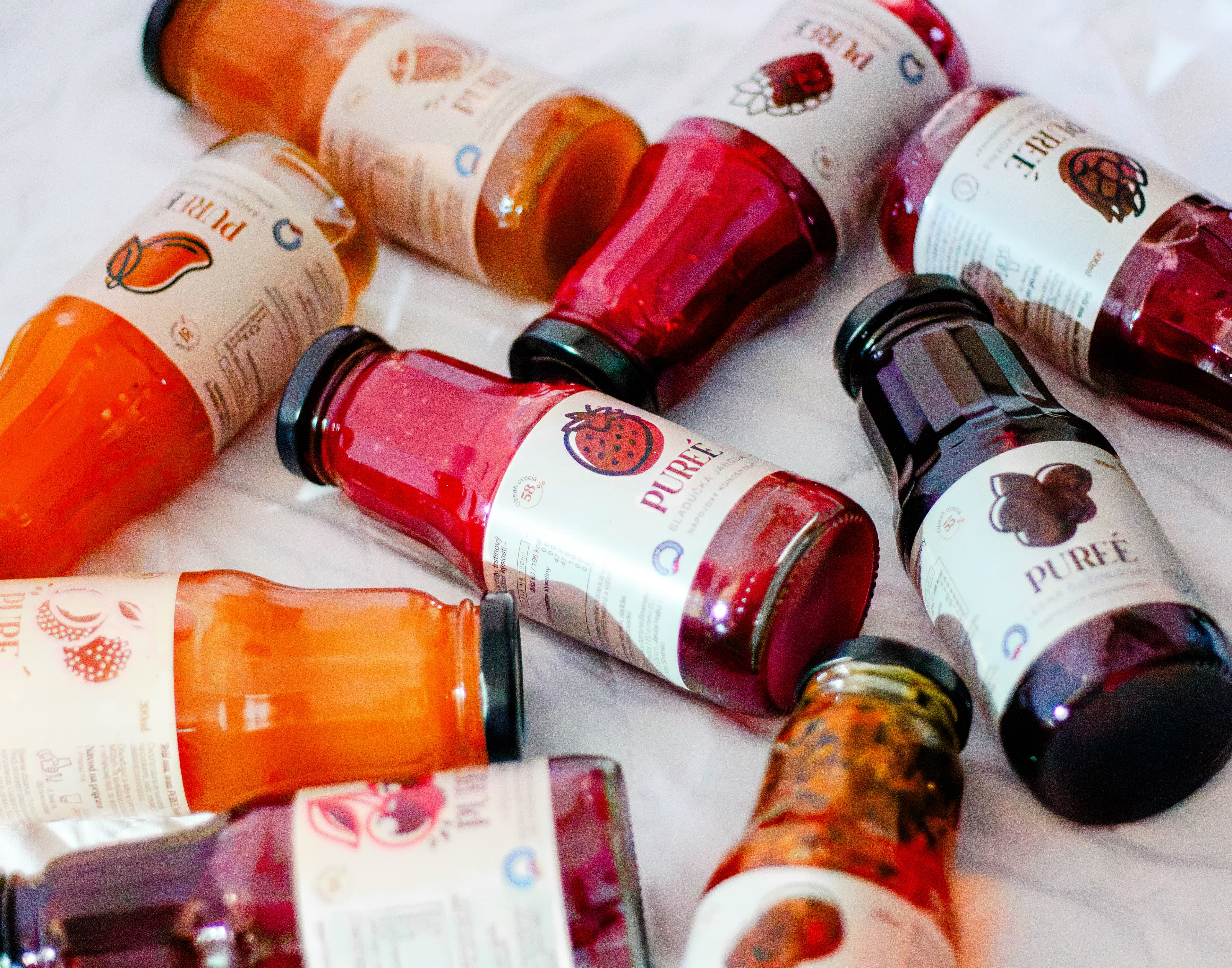 Collage of PUREÉ fruit concentrate bottles
